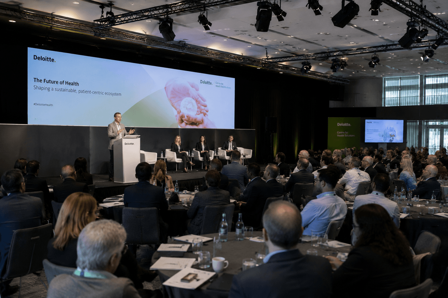 Healthcare leadership session with a wide conference stage